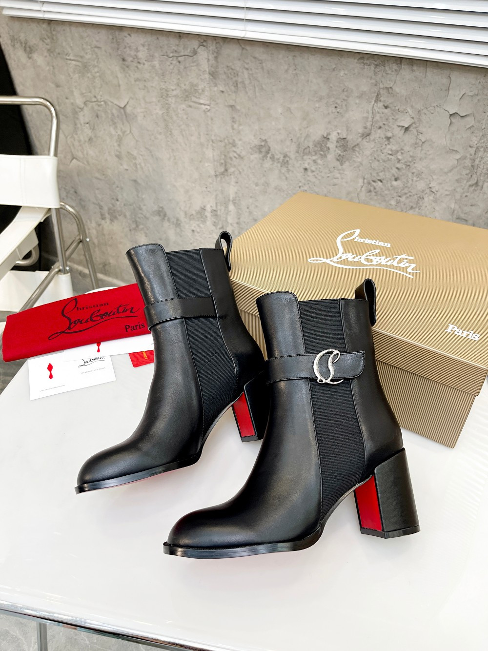 UA Ch**an Louboutin (CL) launched a new collection of chunky heeled platform boots