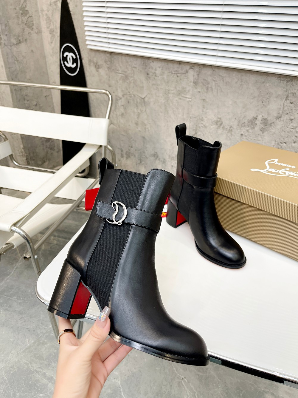 UA Ch**an Louboutin (CL) launched a new collection of chunky heeled platform boots